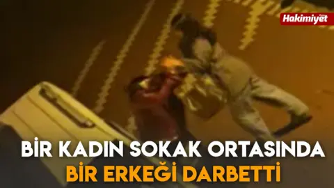 Bir kadın sokak ortasında bir erkeği darbetti