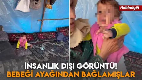 İnsanlık dışı görüntü! Bebeği ayağından bağlamışlar